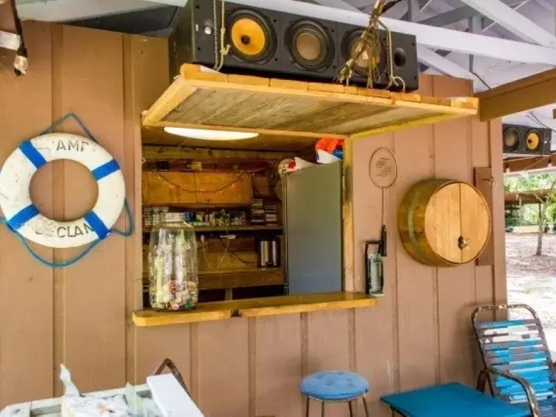 A room with a bar and a clock on the wall