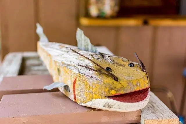 A fish made out of paper and cardboard