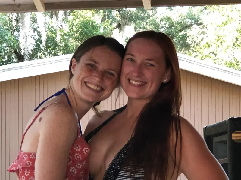 Two women smiling for a picture together.